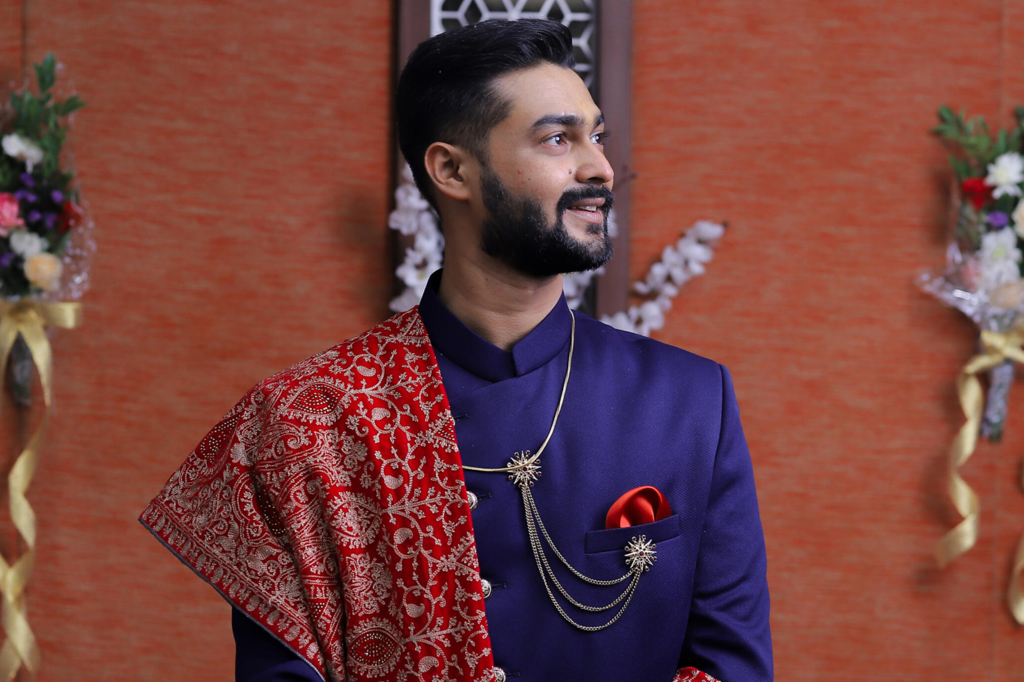 Professional portrait of a man wearing a traditional white kurta in an outdoor setting, captured by Mumbai photographer Aditya.