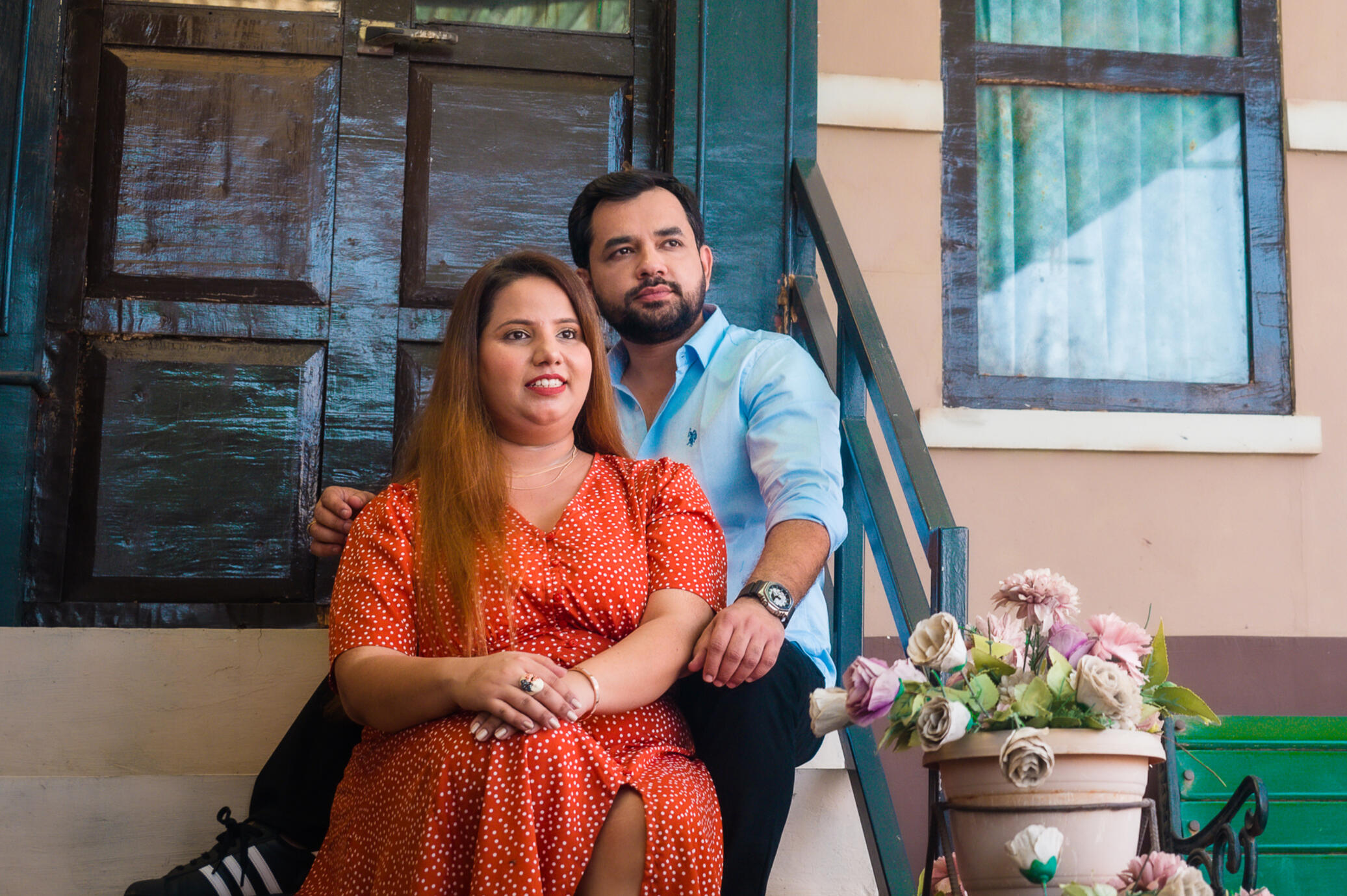 Professional lifestyle photography of a couple at a luxury outdoor camp with aesthetic tent styling, captured by Mumbai photographer Aditya.